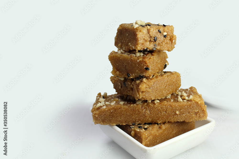 Sukhadi or Gor Papdi is Indian Traditional sweet made with wheat flour,desi ghee,jaggeery and nuts.very healthy Gujarati Mithai Sukhadi or Gor Papdi is Indian Traditional sweet made with wheat flour,desi ghee,jaggeery and nuts.very healthy Gujarati Mithai