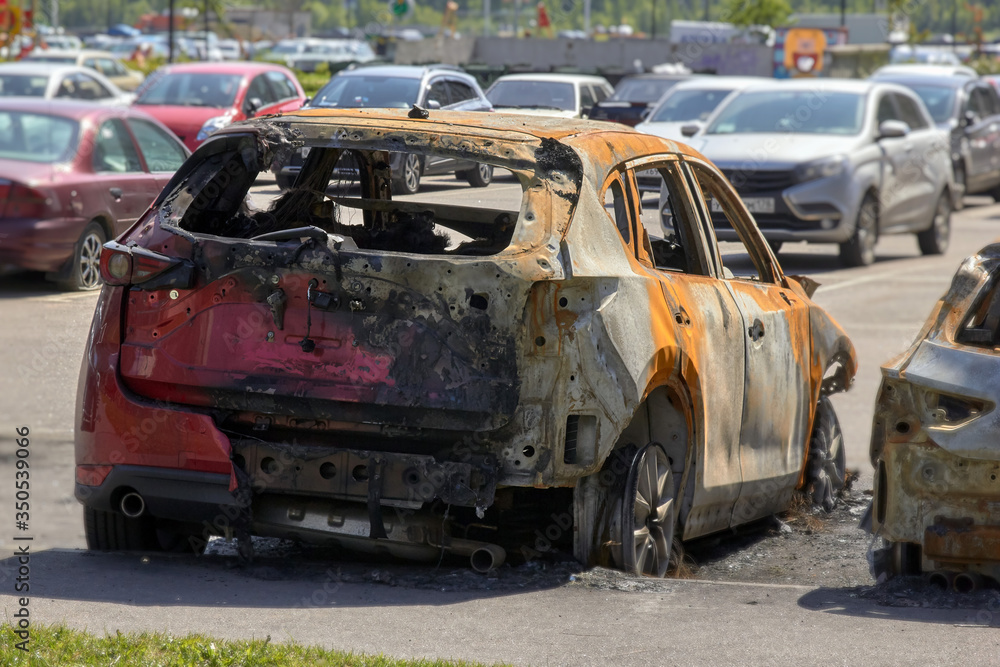 city burned cars after a fire in one of the city's districts