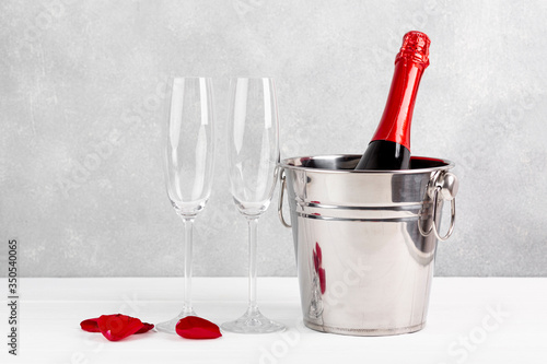 Front view valentine's day arrangement with champagne and glasses