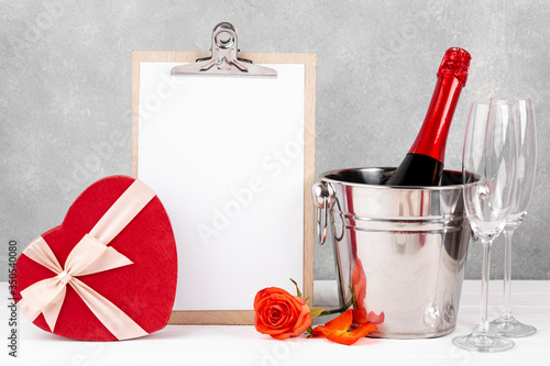 Front view valentine's day composition with empty clipboard