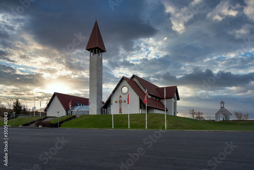 Snorrastofa Museum building and church in Reykholt, Iceland next the home of the famous and historic Writer Snorre Sturlason at blue hour with dramatic skies. photo
