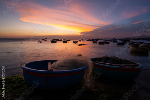 Fishing boats on Binh Thuan beach on the sunrise on Binh Thuan province, Vietnam