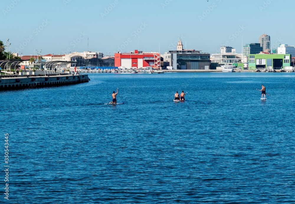 Paddlers in kayaks in the morning in the port