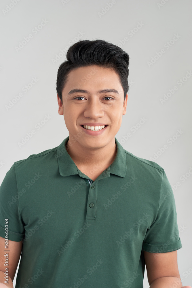 Close-up portrait of smiling handsome bearded man in white shirt looking at camera isolated on white background Close-up portrait of smiling handsome bearded man in white shirt looking at camera isolated on white background