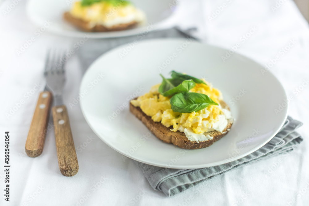 Toast with scrambled eggs Toast with scrambled eggs