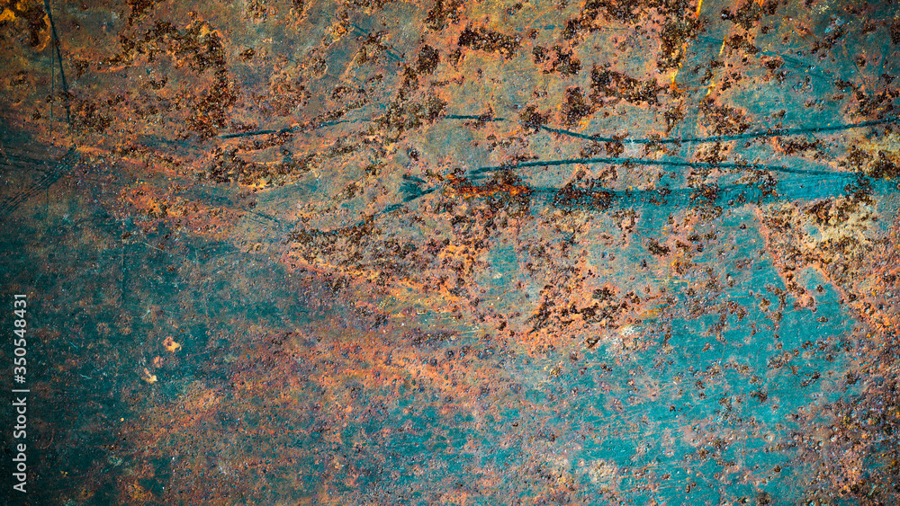 The background image of the iron sheet is rusting caused by prolonged use.Close up of black rust on an old sheet of metal texture. The background image of the iron sheet is rusting caused by prolonged use.Close up of black rust on an old sheet of metal texture.