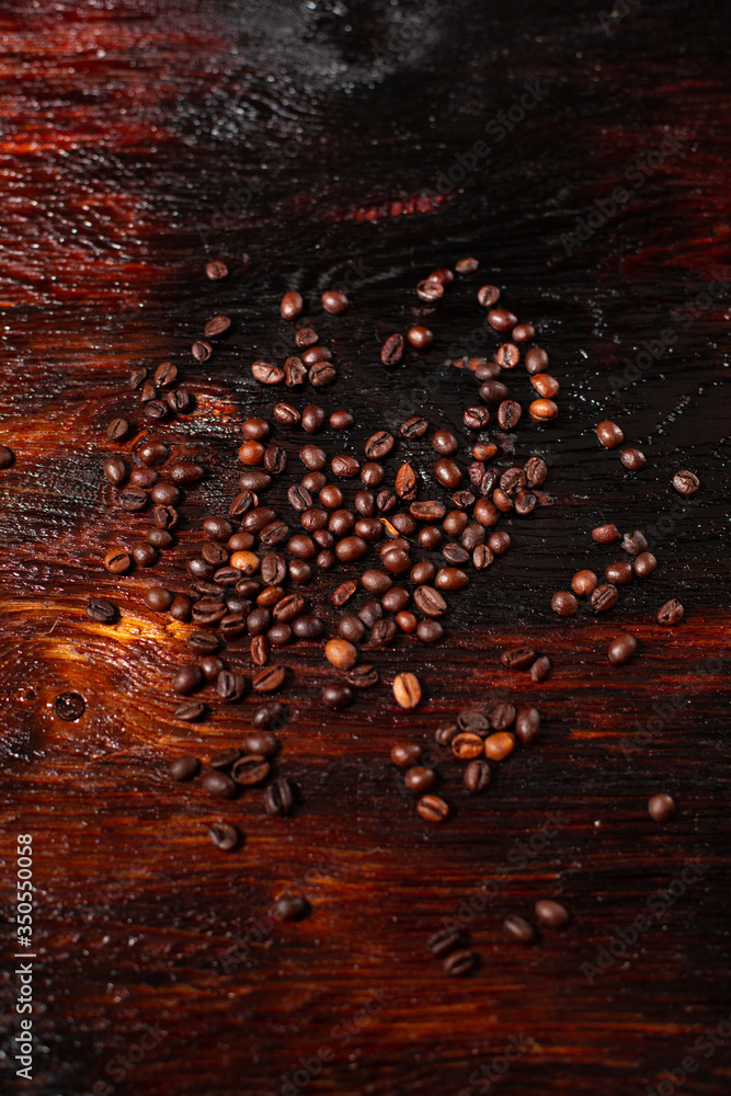 Coffee beans on the wooden table