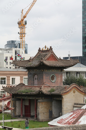 View of Ulaanbaatar city, Mongolia. Ancient and modern architecture together. Building facade of Choijin Lama Temple Museum. Ulaanbaatar landmark, architectural monument, sight, attraction, cityscape photo