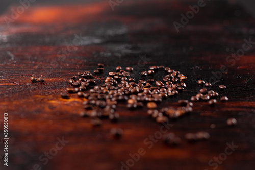 Coffee beans on the wooden table