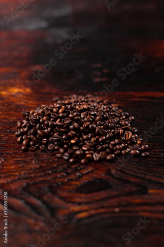 Coffee beans on the wooden table