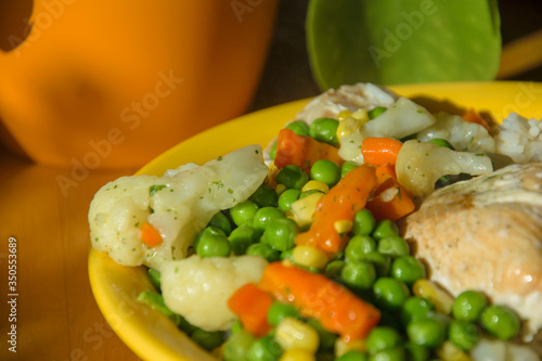 Close Up of a colorful healthy dinner with fish, rice and vegetables