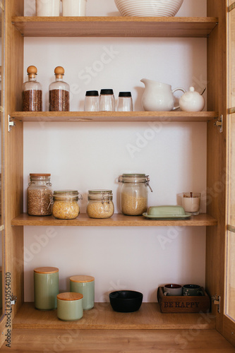 stocked and organiswd kitchen cupboard. cooking from pantry