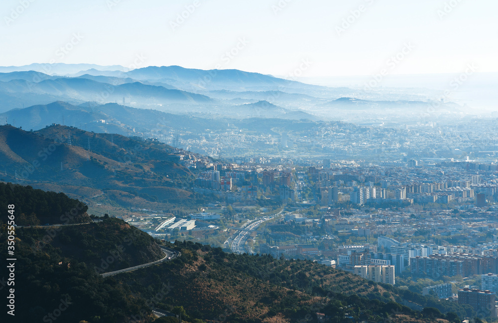 barcelona and mountains in fog