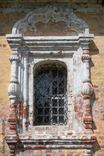 Window. Architectural detail of the temple of the 18th century. Transfiguration church (Preobrazhenskaya) in Rogozha village. Tver Oblast, Russia. photo