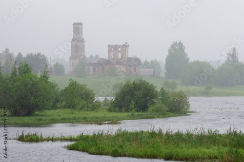 Upper Volga landscape. Ruins of the church on the bank of Sterzh Lake. Novinka village, Tver Oblast, Russia.