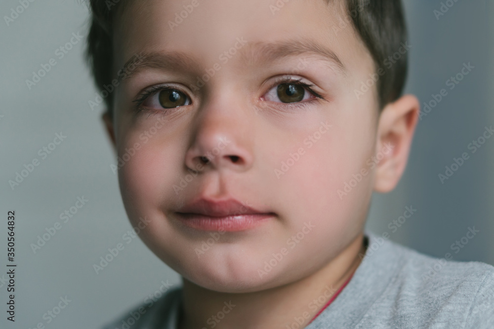 close up of upset toddler boy looking at camera close up of upset toddler boy looking at camera