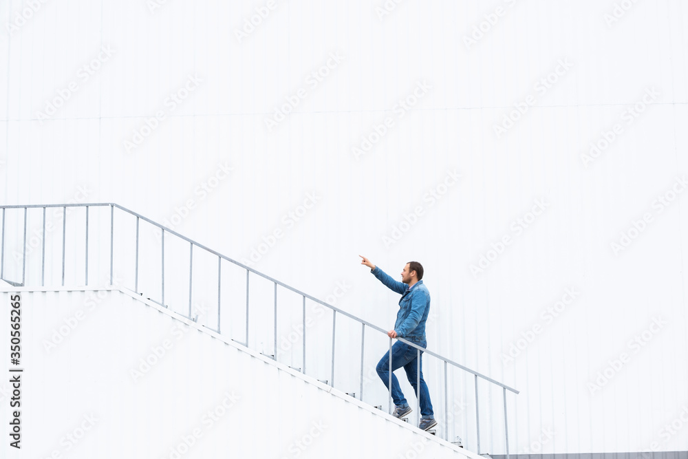 A man goes up the stairs. Career ladder. Photo of a man walking up the stairs. Career growth concept.