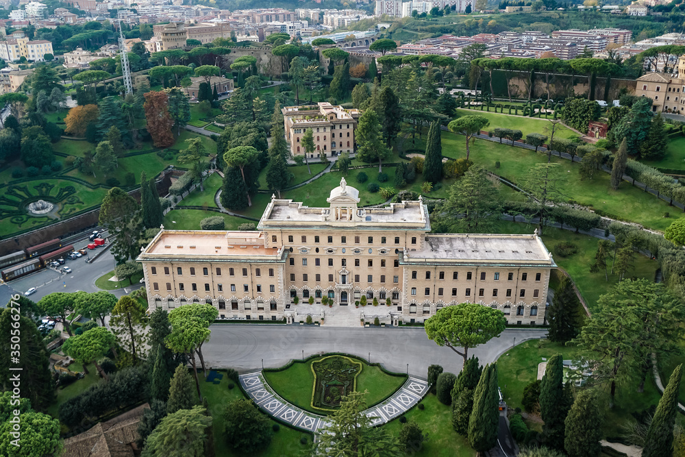 ancient building near green gardens of Vatican