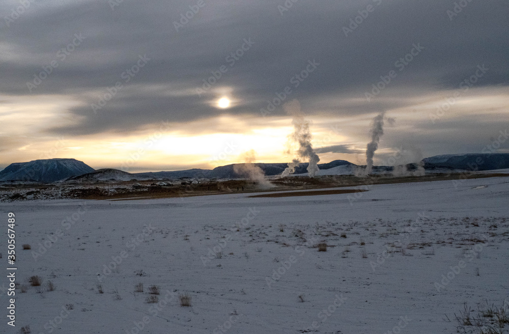 Snowy landscape in Hvrir in Iceland at sunset with its volcanic chimneys