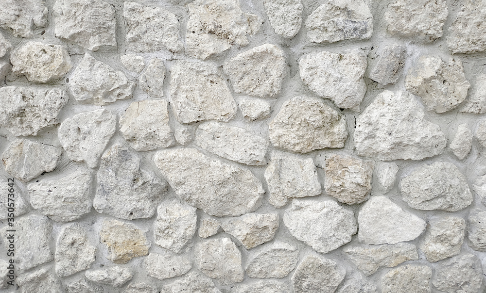 Light stone masonry texture background. Stone wall Light stone masonry texture background. Stone wall