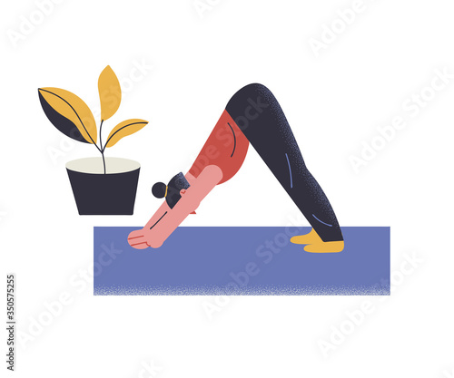 Girl doing yoga and staying at home during coronavirus pandemic