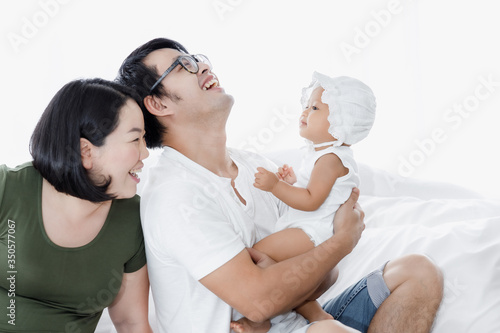 happy family on the white bedroom stay at home concept