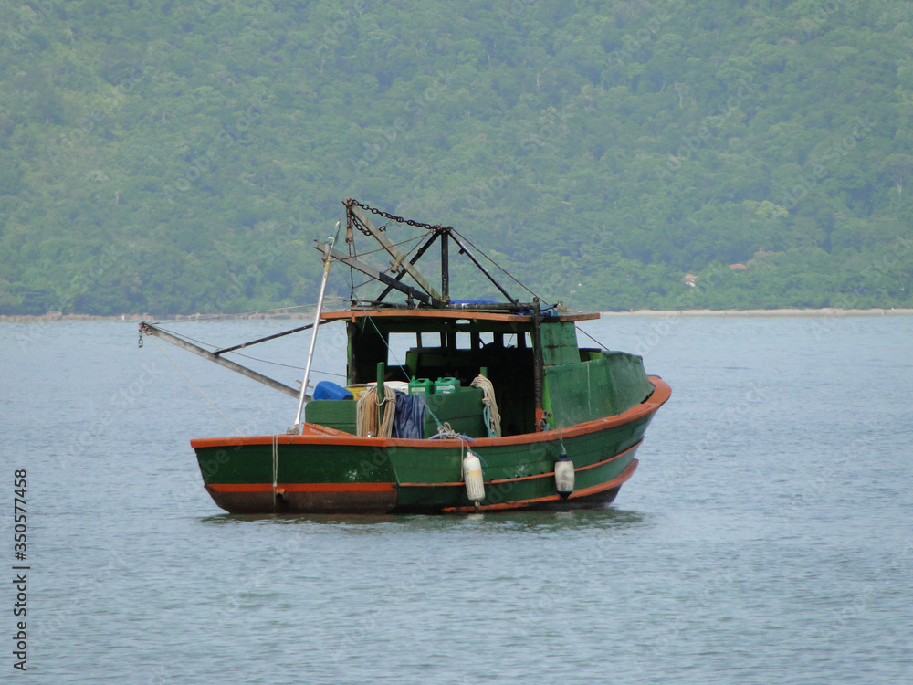 Fisherman's boat on the coast of the city of Ubatuba, São Paulo, Brazil                              