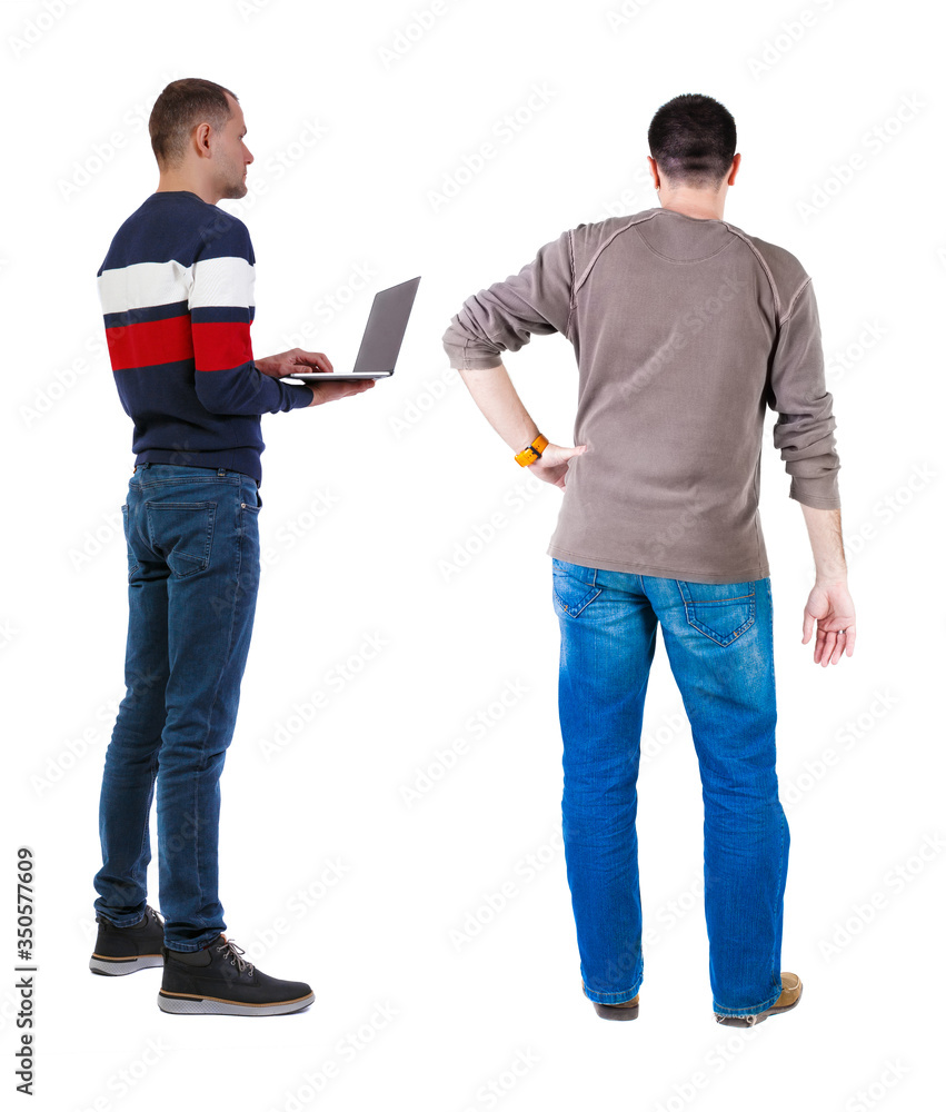 Back view two man in sweater with laptop. Back view two man in sweater with laptop.