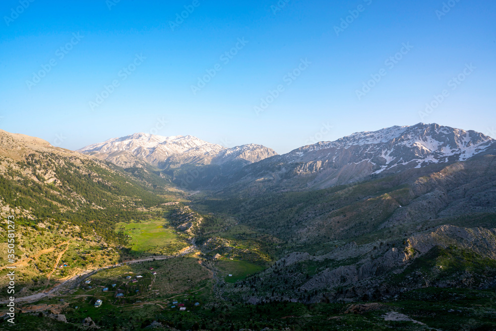 Lake Egrigol (eğrigöl), a hidden gem sitting at 2,350 meters in the foothills of Geyik Mountain in Antalya province, Surrounded by 3 or 4 meters of snow on one side and mountain wild flowers