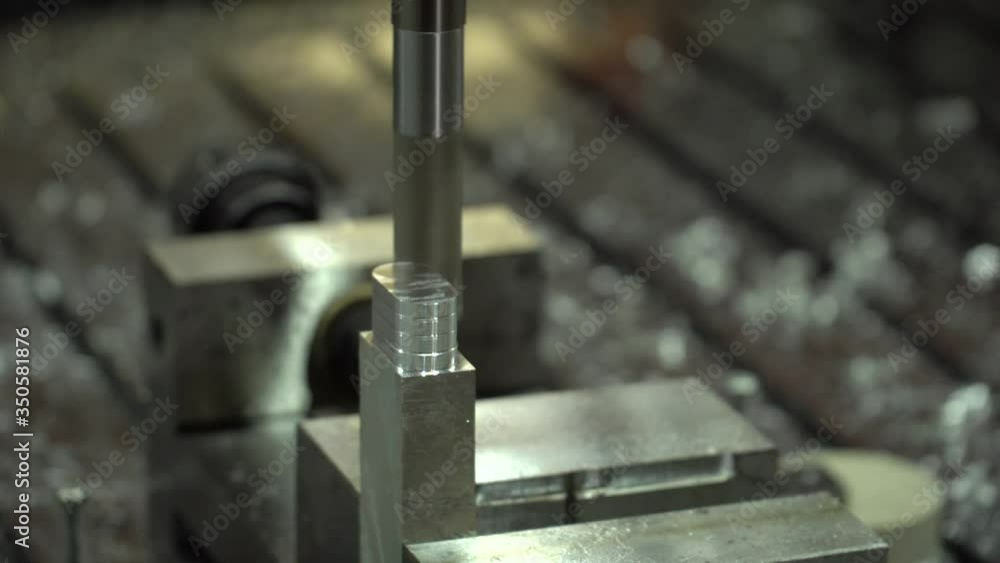 CNC milling machine produces detail from aluminum CNC milling machine produces detail from aluminum