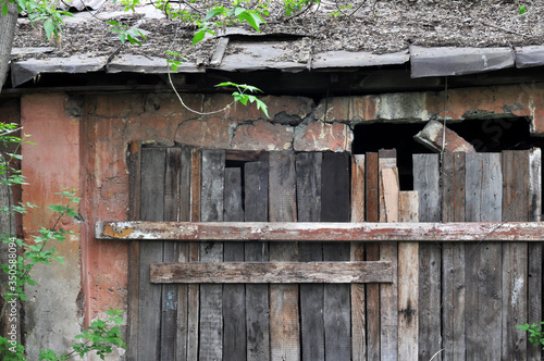 Old weathered wooden fence. Rustic barn wood texture