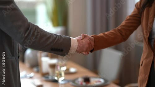 Business people shaking hands in a restaurant