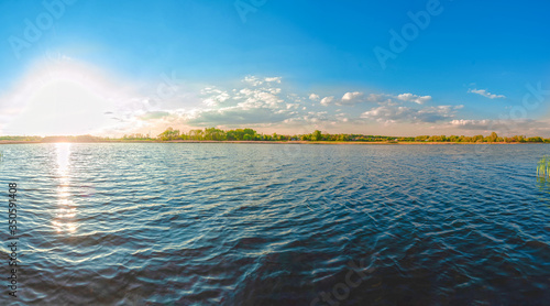 Panoramic view of the Kamenka river in the Zhytomyr region of Ukraine. Beautiful landscape of a large blue pond photo