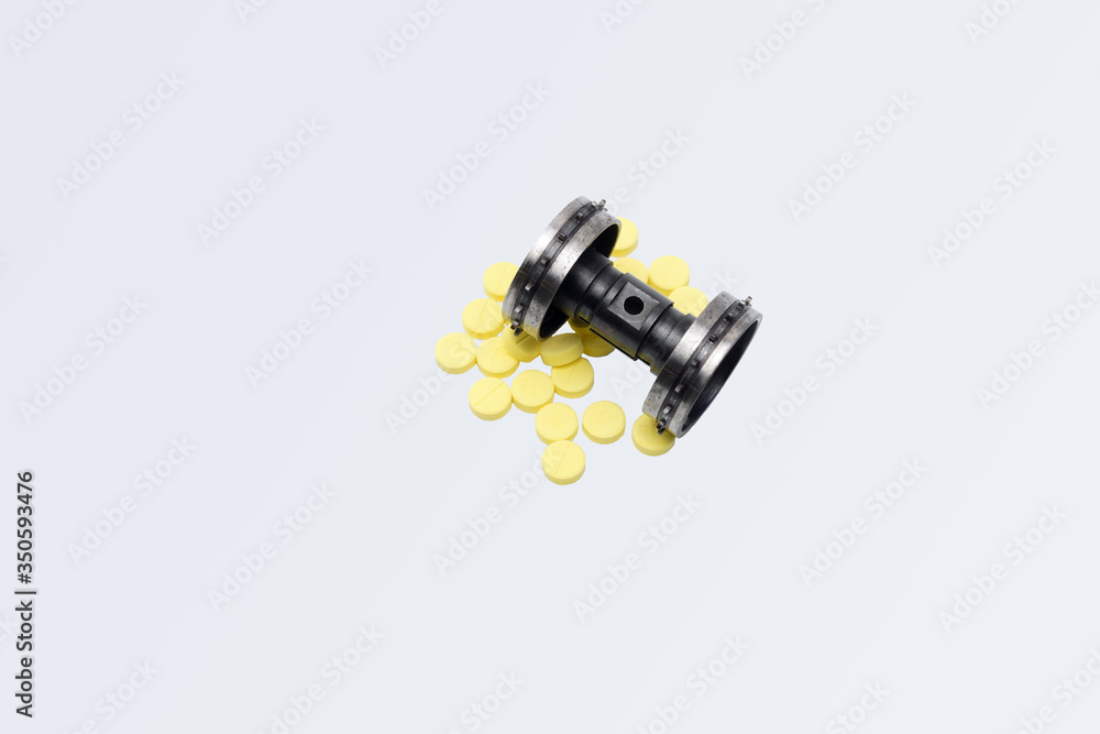 Abstact of a sprocket wheel on a yellow drugs is concepts about stopping and Crushing to Virus or Disease of health care. Abstact of a sprocket wheel on a yellow drugs is concepts about stopping and Crushing to Virus or Disease of health care.