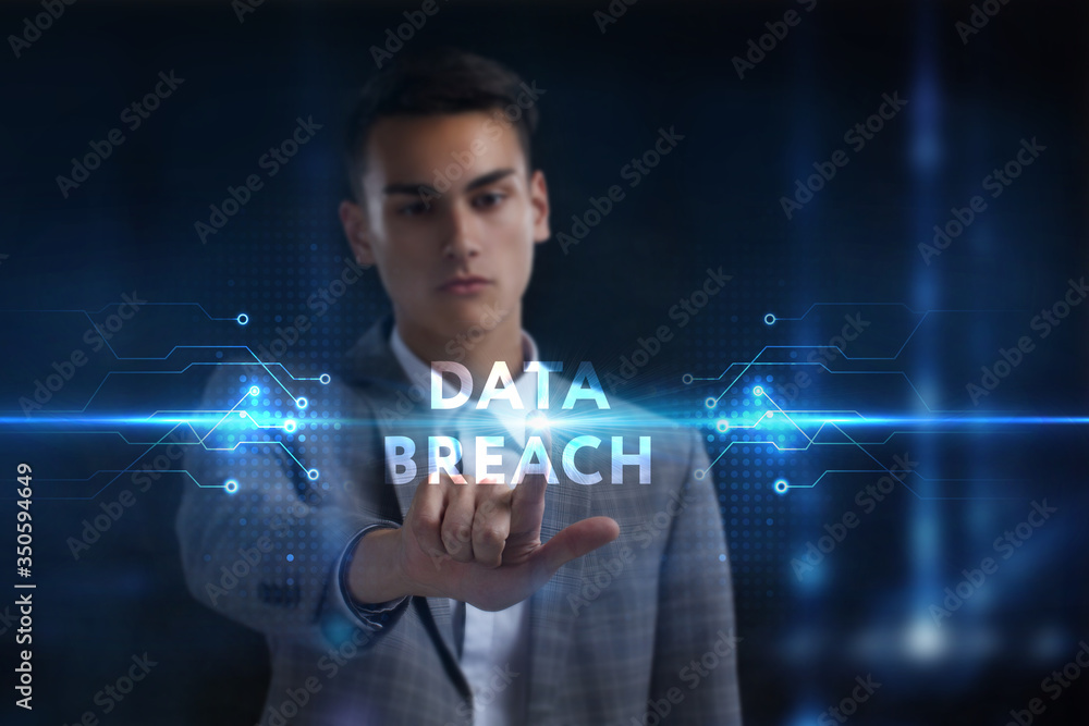 Business, Technology, Internet and network concept. Young businessman working on a virtual screen of the future and sees the inscription: Data breach Business, Technology, Internet and network concept. Young businessman working on a virtual screen of the future and sees the inscription: Data breach