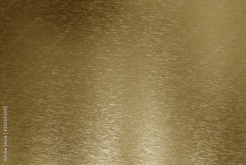 Metallic golden gradient background with thin scratches Metallic golden gradient background with thin scratches