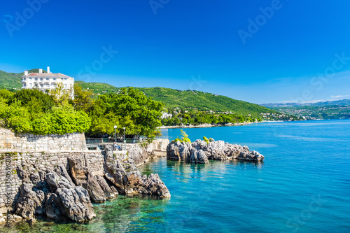 Beautiful Adriatic sea in Croatia, town of Lovran riviera, coastline villas in Kvarner bay
