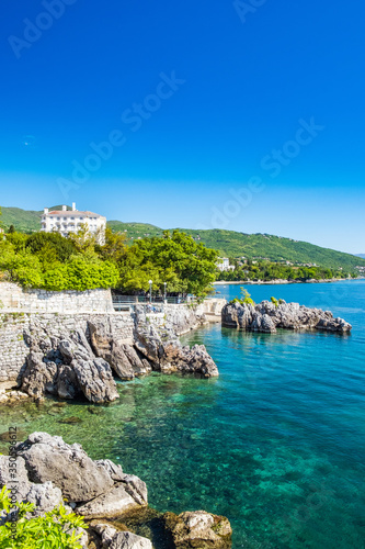 Beautiful Adriatic sea in Croatia, town of Lovran riviera, coastline villas in Kvarner bay photo