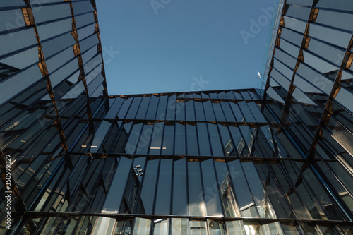 Принти на полотні glass facades of modern office buildings and reflection of blue sky