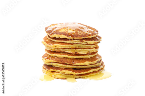 Tasty pancakes with honey isolated on white background. Sweet breakfast