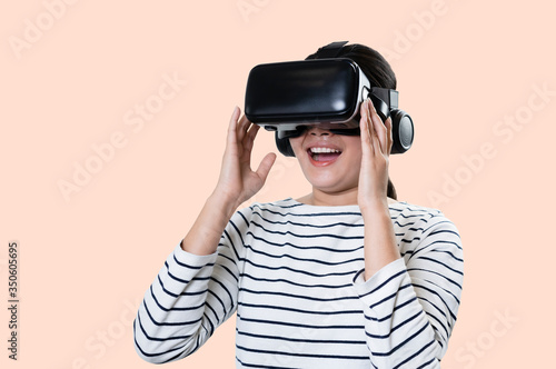 Smile happy enjoying woman getting experience using VR goggles headset glasses of virtual reality.