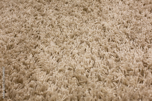 Handmade fluffy carpet texture, closeup. Wallpaper. 