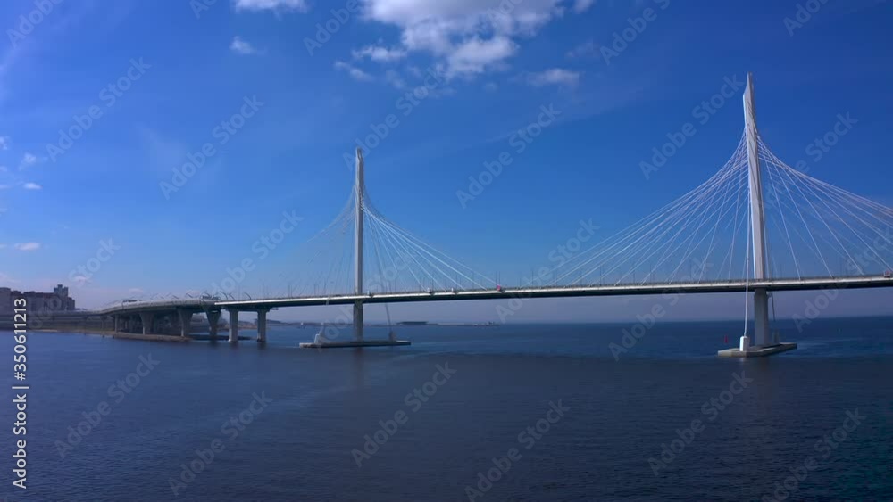 Aerial view of the bridge over the Petrovsky fairway. Western high-speed diameter of St. Petersburg. Drone flight over the city on a sunny day. Aerial view of the bridge over the Petrovsky fairway. Western high-speed diameter of St. Petersburg. Drone flight over the city on a sunny day.