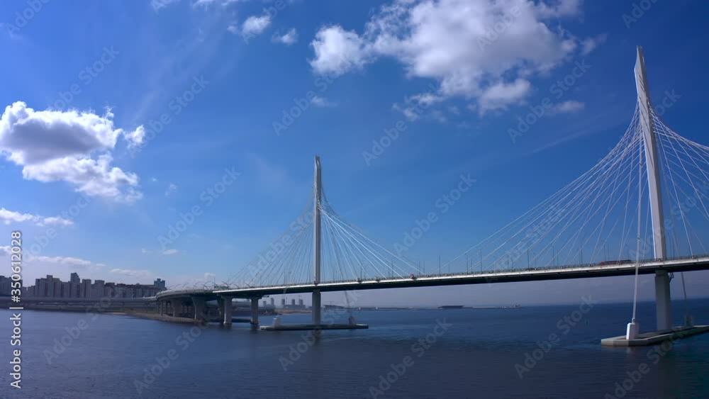 Aerial view of the bridge over the Petrovsky fairway. Western high-speed diameter of St. Petersburg. Drone flight over the city on a sunny day. Aerial view of the bridge over the Petrovsky fairway. Western high-speed diameter of St. Petersburg. Drone flight over the city on a sunny day.