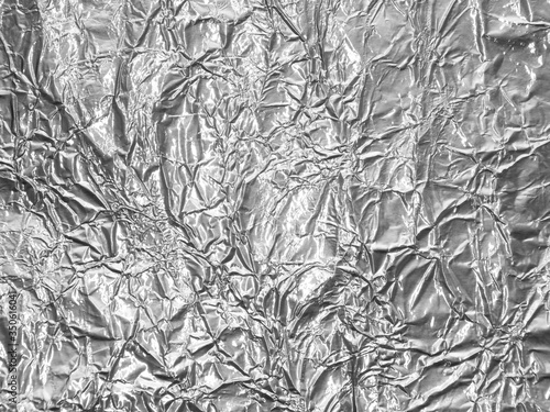 Silver metallic crumpled foil texture background