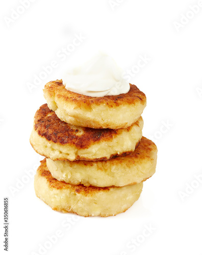 cottage cheese pancakes (syrniki) isolated on white background