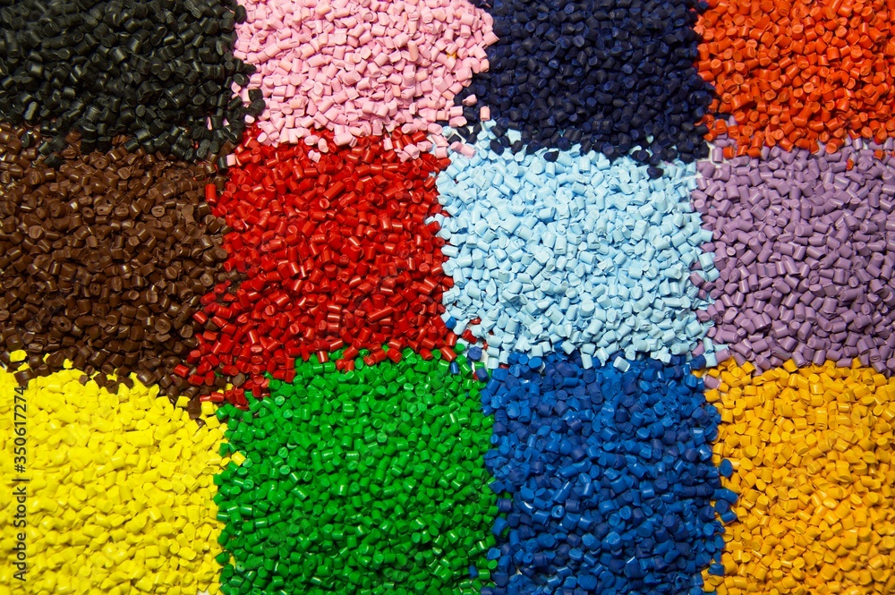 Colorful  polymer granules used as raw material in plastic industry 