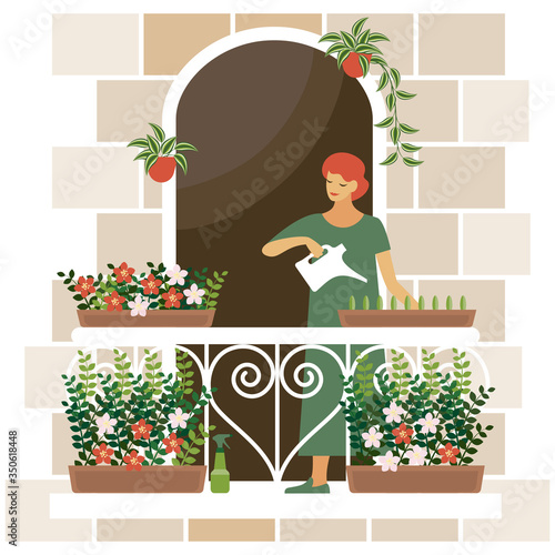 girl watering flowers on the balcony