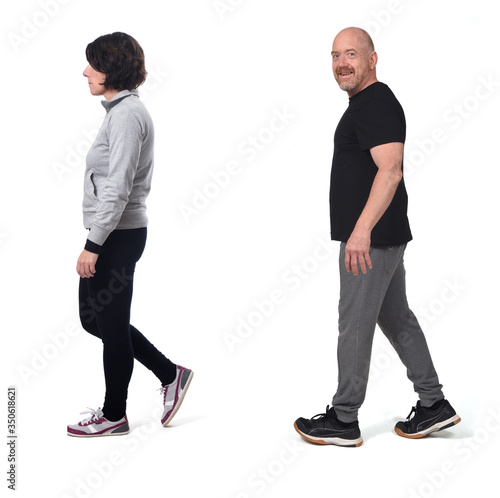 couple walking on white background © curto