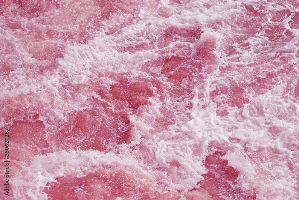 Abstract background, pink rough water surface. Abstract background, pink rough water surface.